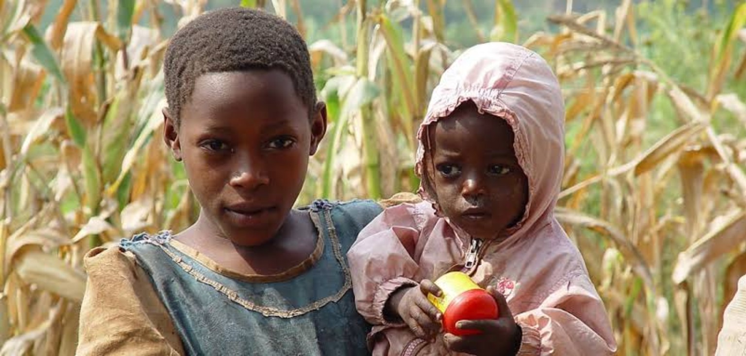 A young person caring for a younger child